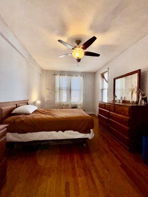601 79th Street, Unit C20 Brooklyn, NY 11209 - Photo 6 of 13 a spacious bedroom with a bed and ceiling fan