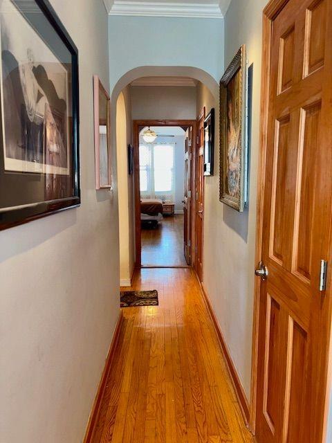 601 79th Street, Unit C20 Brooklyn, NY 11209 - Photo 7 of 13 a view of a hallway with wooden floor and staircase