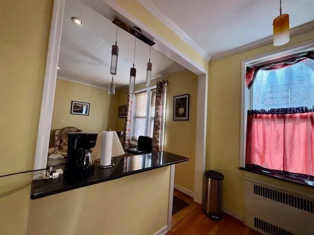 a view of a living room with furniture and a window