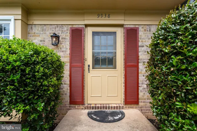 a view of small garden with wooden fence