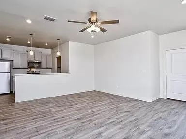 a view of kitchen with wooden floor and window