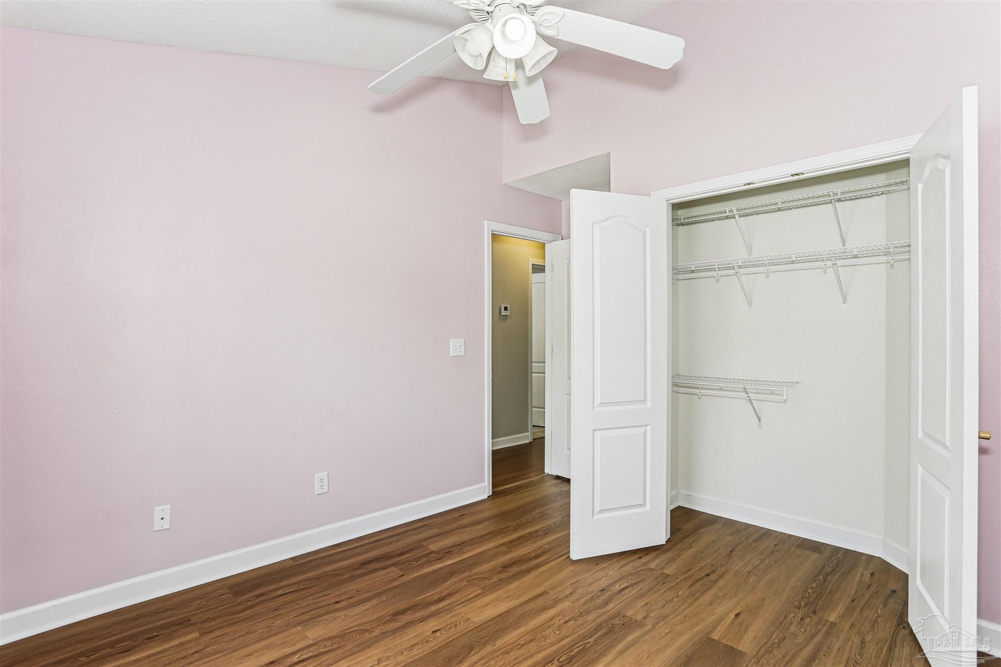 1062 Joaquin Road Pensacola, FL 32506 - Photo 28 of 42 wooden floor in an empty room with a window