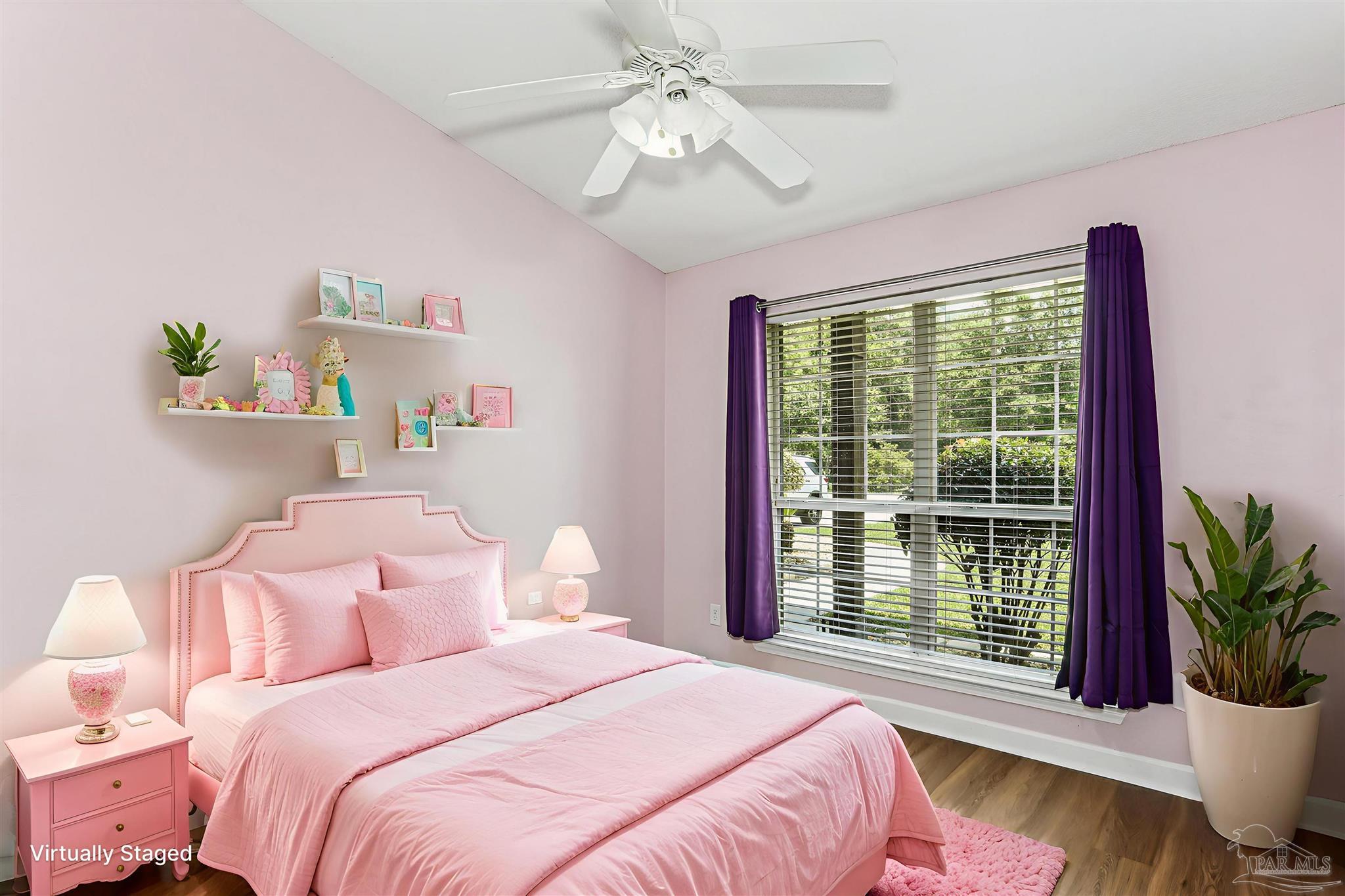 1062 Joaquin Road Pensacola, FL 32506 - Photo 30 of 42 a bedroom with a bed and a potted plant