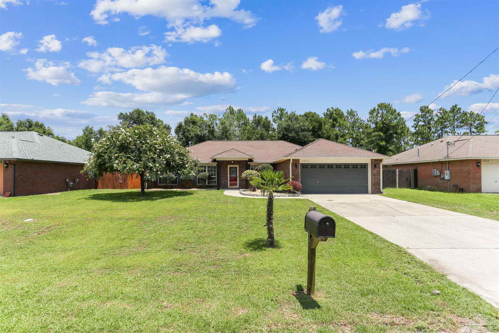 1062 Joaquin Road Pensacola, FL 32506 - Photo 3 of 42 a view of a house with a yard