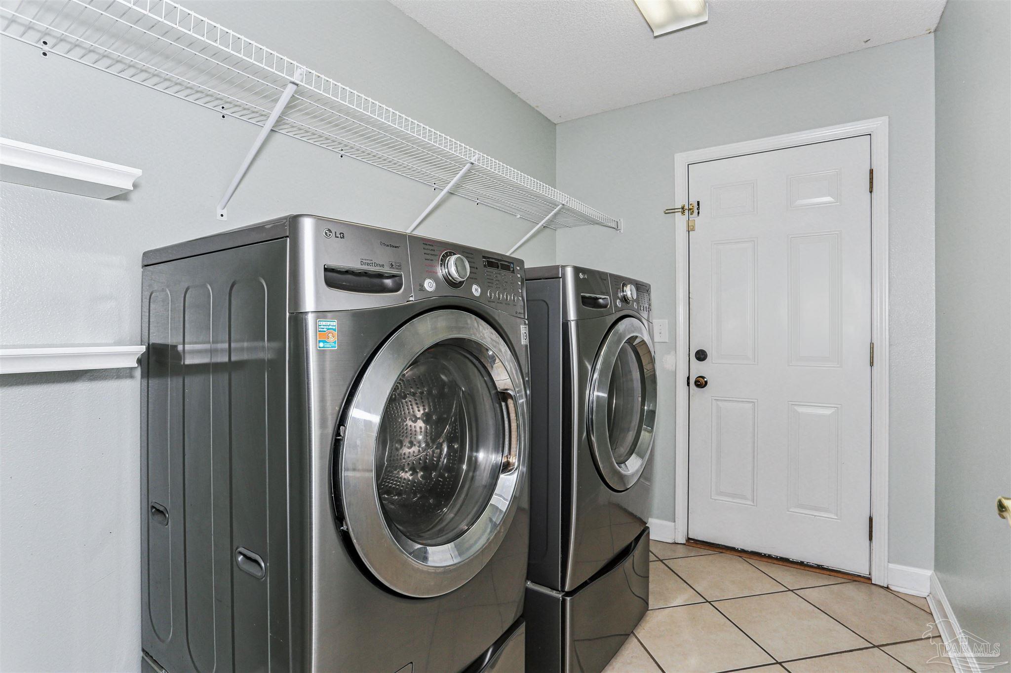 1062 Joaquin Road Pensacola, FL 32506 - Photo 36 of 42 a utility room with dryer and washer