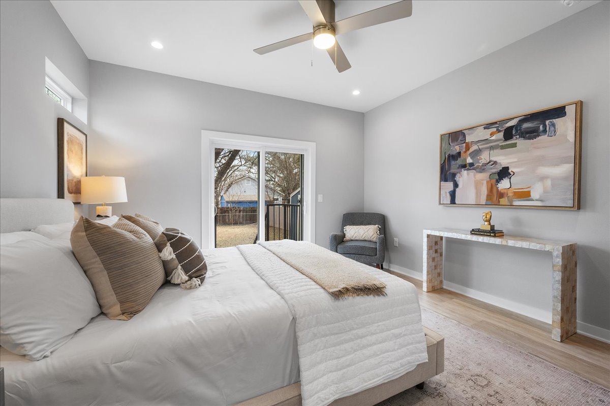 1149 Ebert Avenue, Unit D Austin, TX 78721 - Photo 12 of 34 Bedroom with wood finished floors, access to exterior, ceiling fan, and recessed lighting