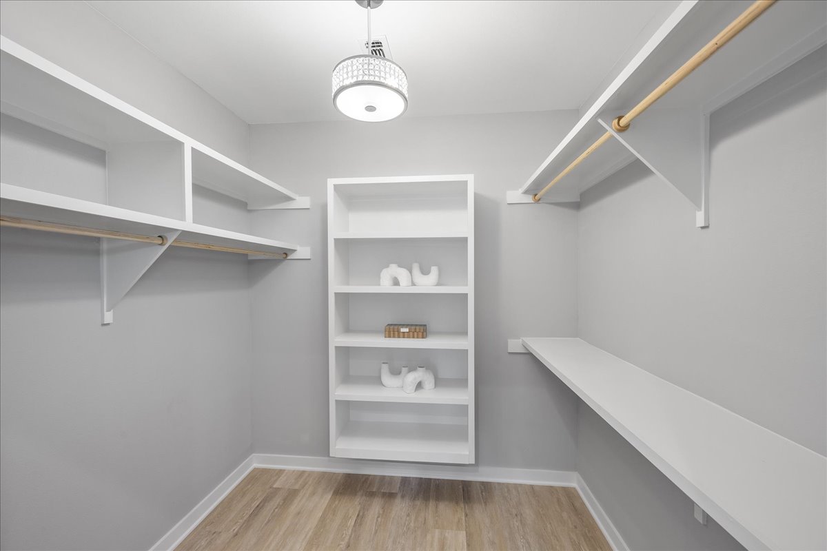 1149 Ebert Avenue, Unit D Austin, TX 78721 - Photo 16 of 34 Walk in closet with light wood finished floors