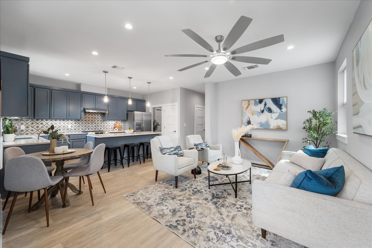 1149 Ebert Avenue, Unit D Austin, TX 78721 - Photo 18 of 34 Living area featuring light wood finished floors, a ceiling fan, and recessed lighting