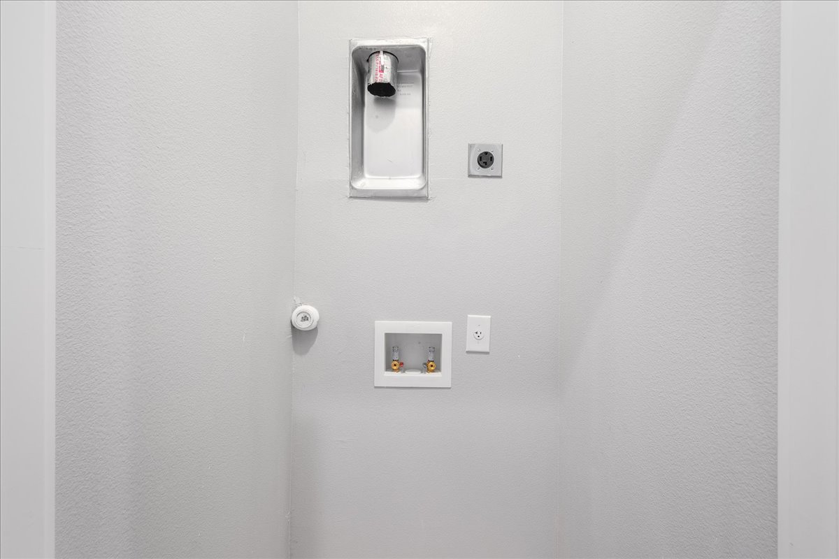 1149 Ebert Avenue, Unit D Austin, TX 78721 - Photo 21 of 34 Laundry area featuring hookup for an electric dryer and washer hookup