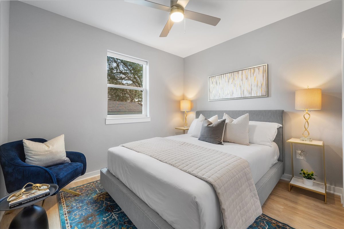 1149 Ebert Avenue, Unit D Austin, TX 78721 - Photo 23 of 34 Bedroom featuring wood finished floors and ceiling fan