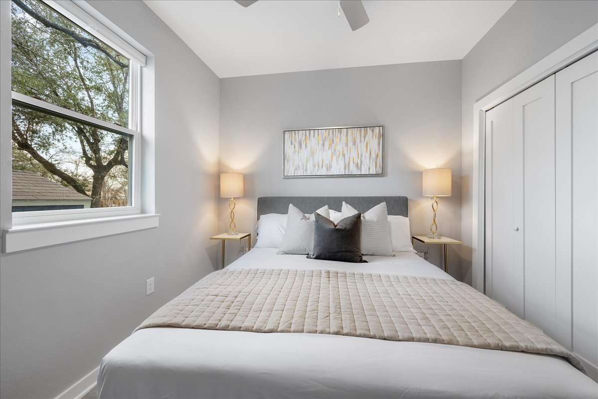 1149 Ebert Avenue, Unit D Austin, TX 78721 - Photo 25 of 34 Bedroom with a closet and ceiling fan