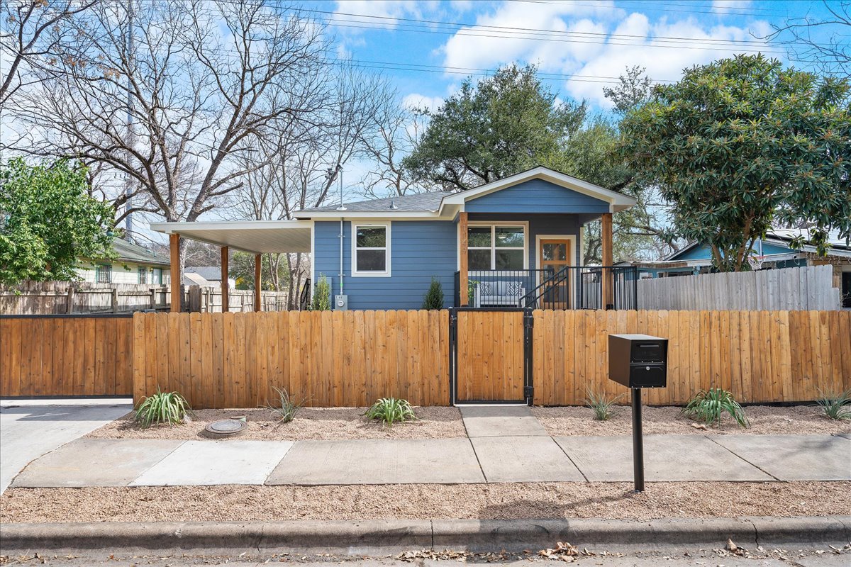 1149 Ebert Avenue, Unit D Austin, TX 78721 - Photo 3 of 34 Bungalow with a gate and a fenced front yard