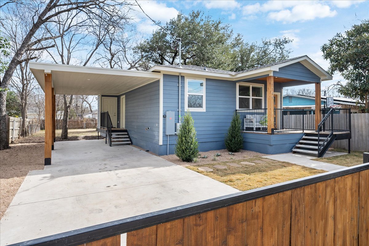 1149 Ebert Avenue, Unit D Austin, TX 78721 - Photo 4 of 34 View of front facade with a carport and concrete driveway