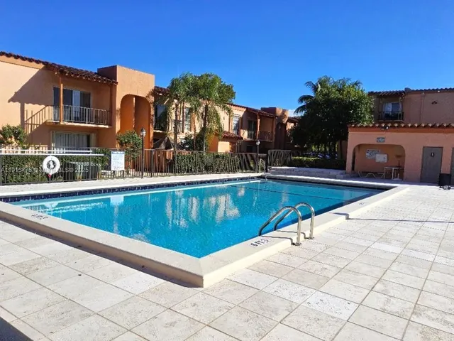 a view of a swimming pool with a lounge chairs
