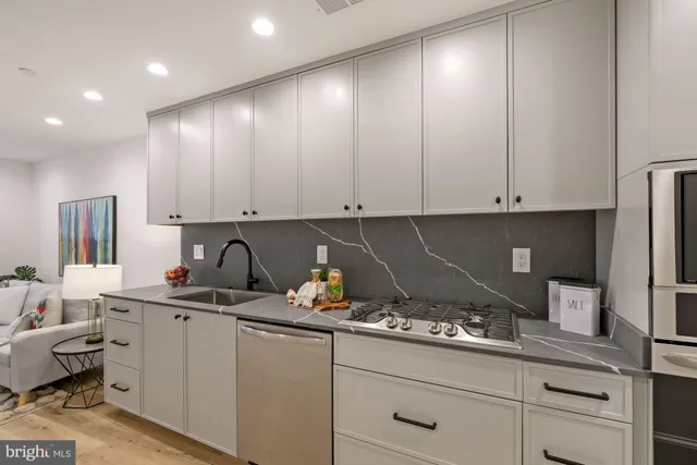 a kitchen with a sink and cabinets