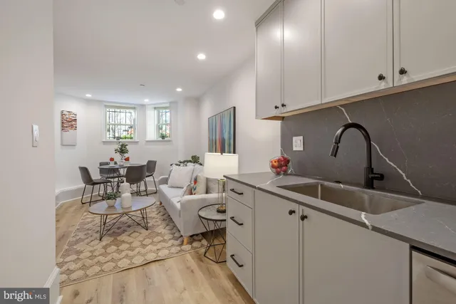 a kitchen with a sink cabinets and appliances