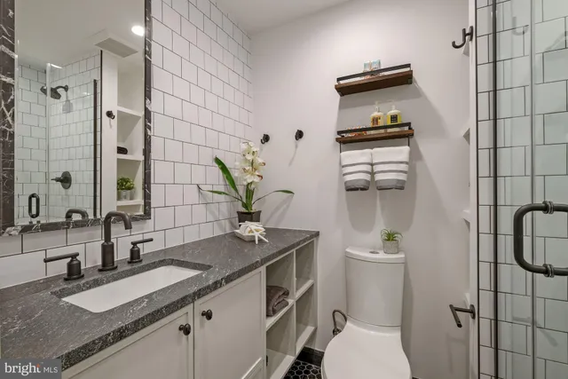 a bathroom with a toilet and shower