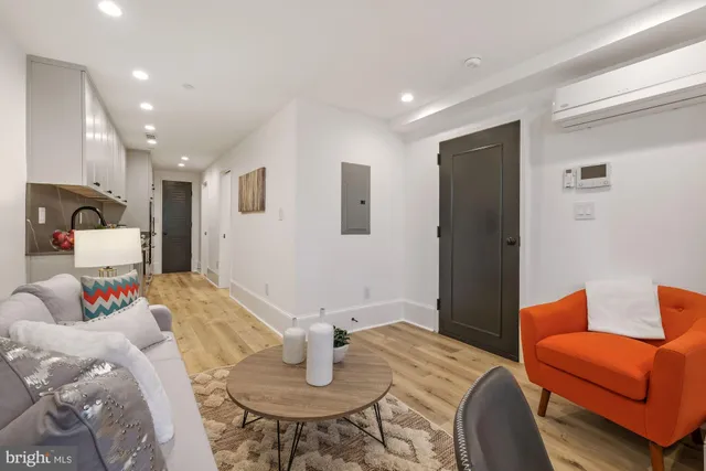 a bedroom with furniture and a chair