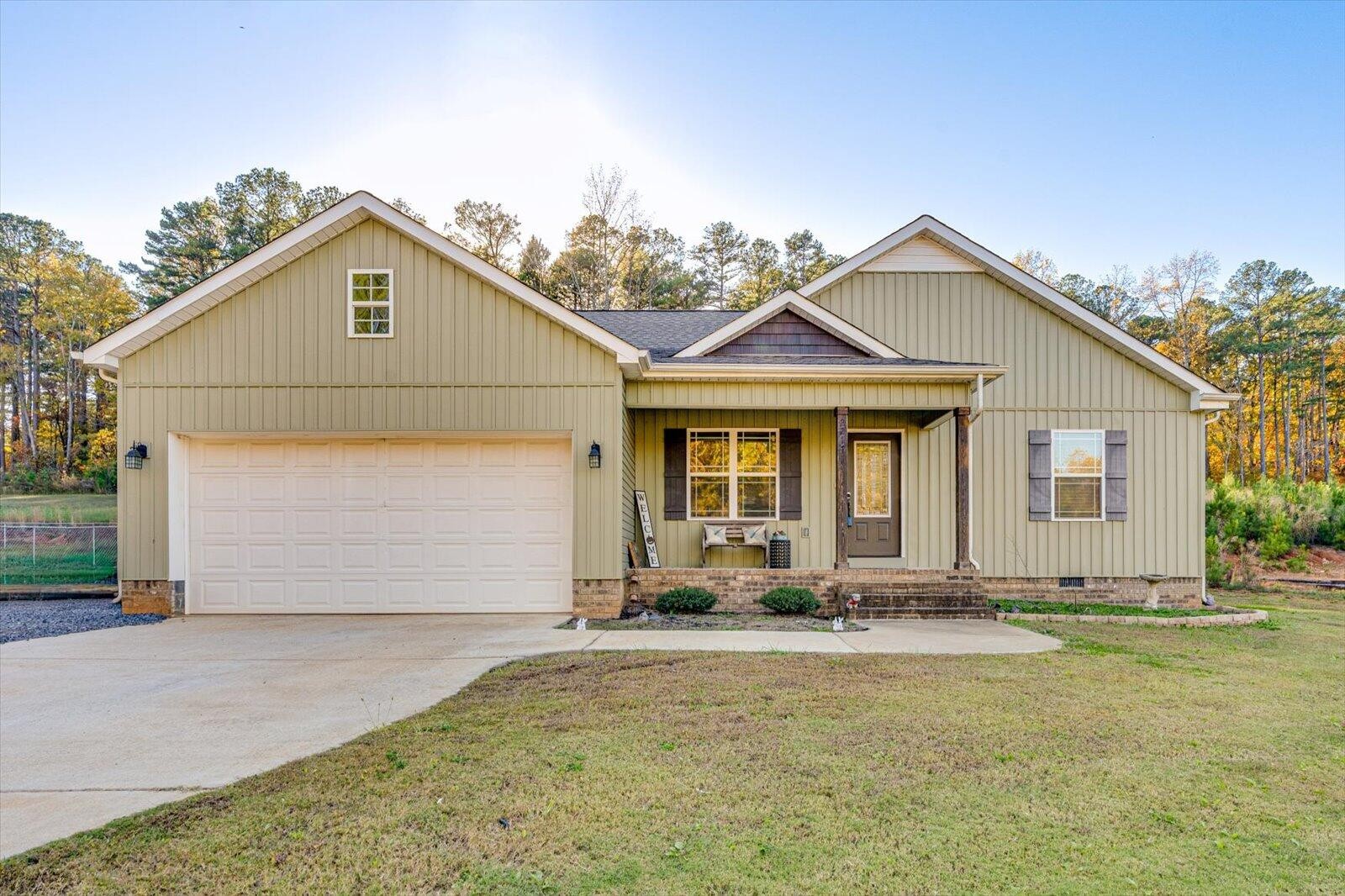 a front view of a house with a yard