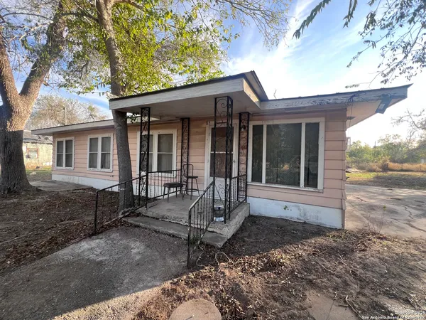 a house with trees in front of it