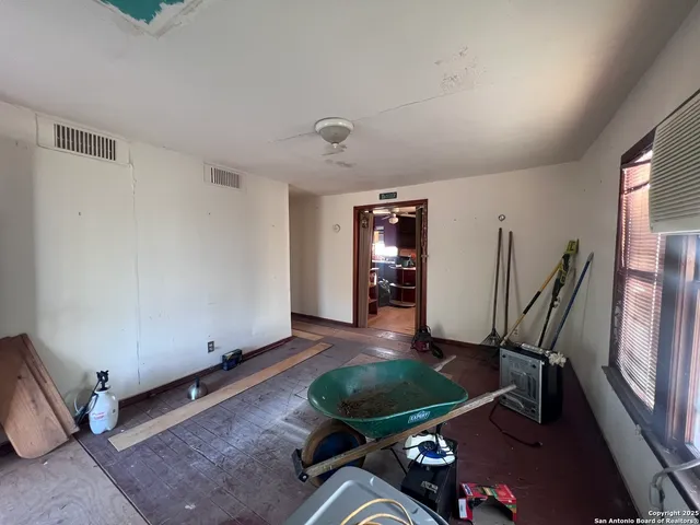 a room with furniture and gym equipment