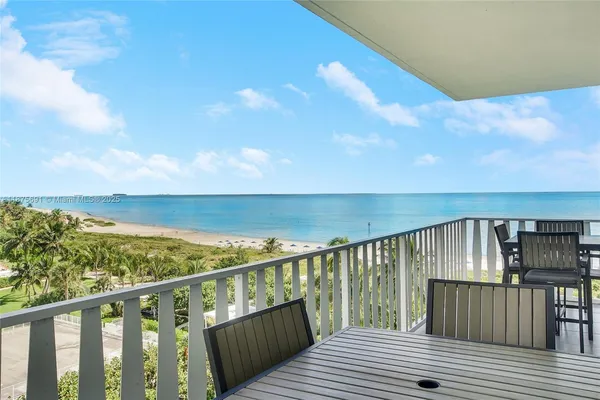 a view of wooden deck and city view