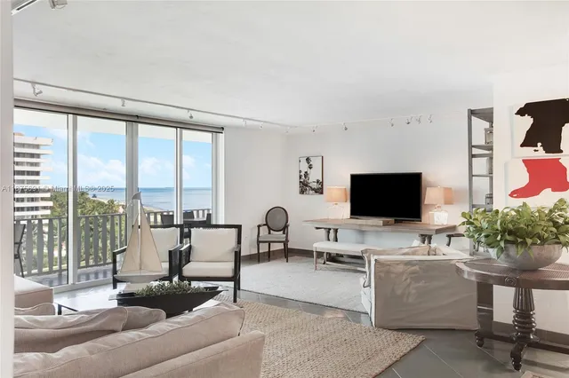 a living room with furniture or couch and a flat screen tv