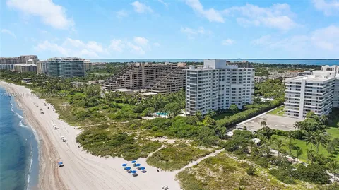 a view of a storage room with water heater and chairs
