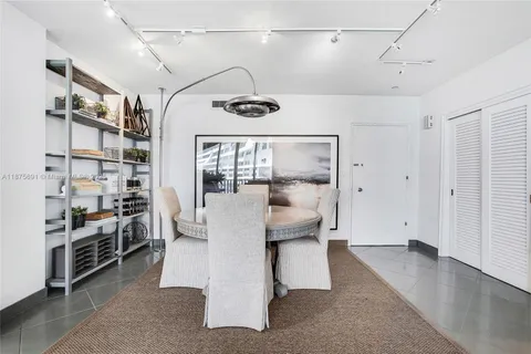 a kitchen with granite countertop cabinets stainless steel appliances a sink and a counter top