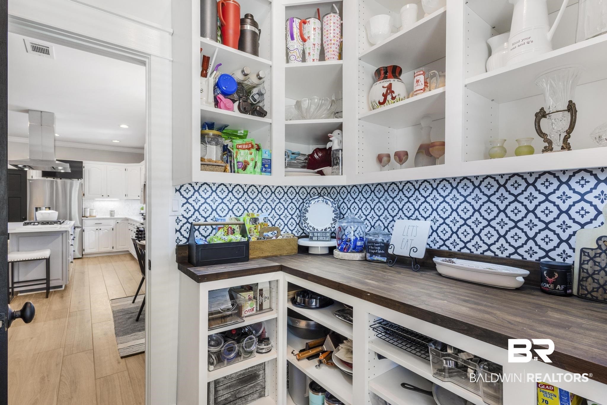 83 Caisson Trace Daphne, AL 36527 - Photo 27 of 63 White cabinetry and open shelving with a patterned backsplash, dark wood-finish countertop, and recessed lighting