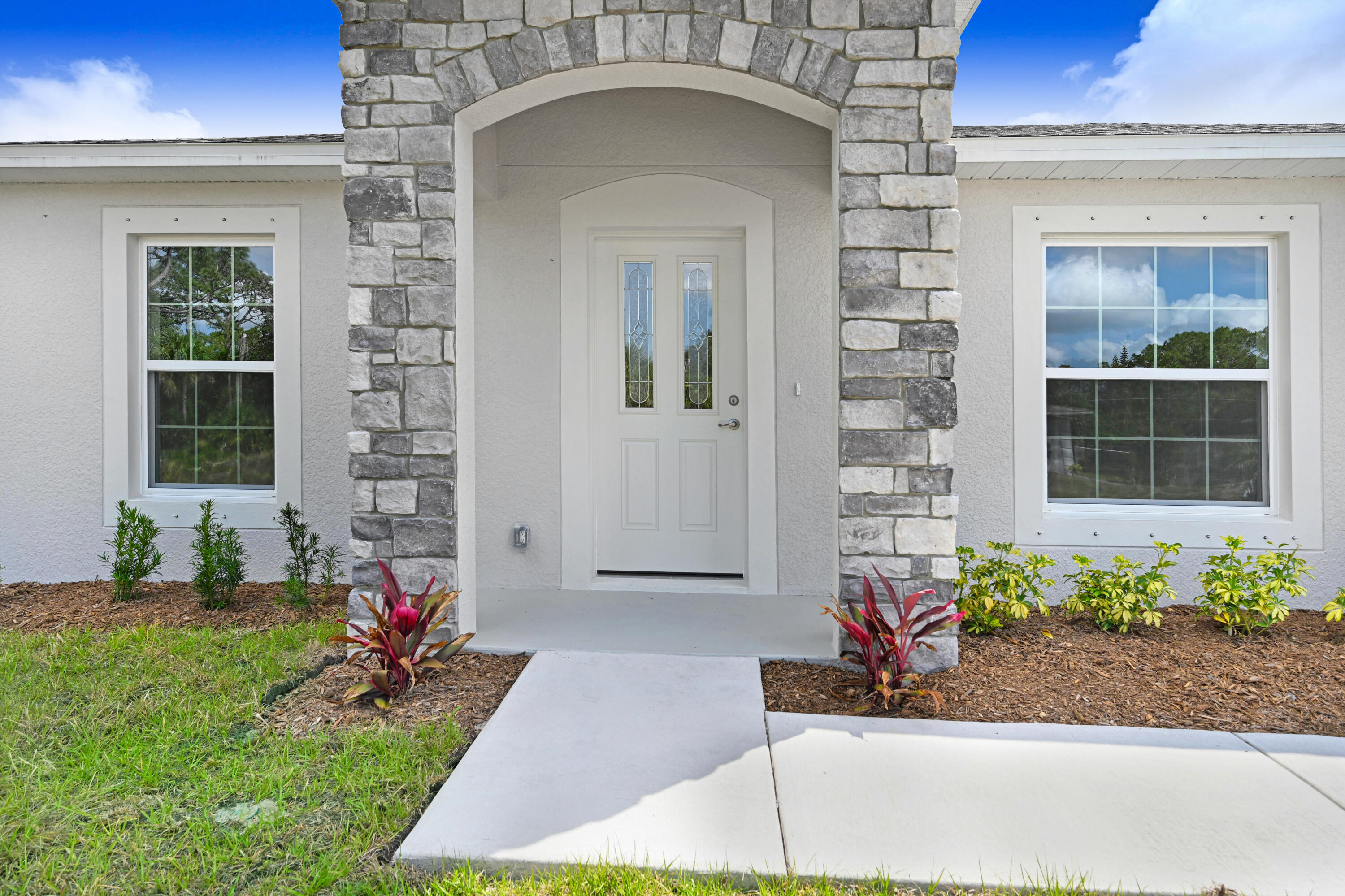239 Trilby Road Southwest Palm Bay, FL 32908 - Photo 3 of 38 a front view of a house with a yard
