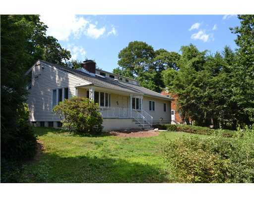 58 Arch Street Riverside, CT 06878 - Photo 2 of 13 a front view of a house with a yard