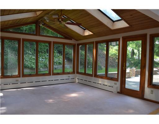 58 Arch Street Riverside, CT 06878 - Photo 5 of 13 a view of an empty room with a large window