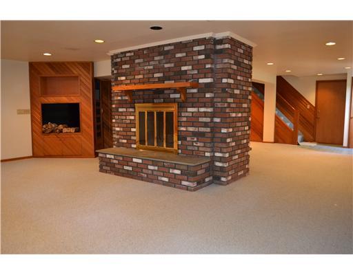 58 Arch Street Riverside, CT 06878 - Photo 7 of 13 a view of an empty room with a fireplace