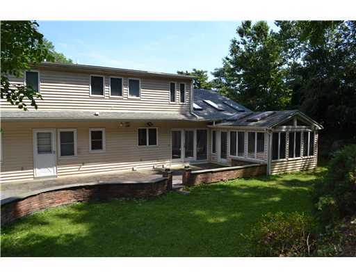 58 Arch Street Riverside, CT 06878 - Photo 9 of 13 a view of a house with a yard and sitting area