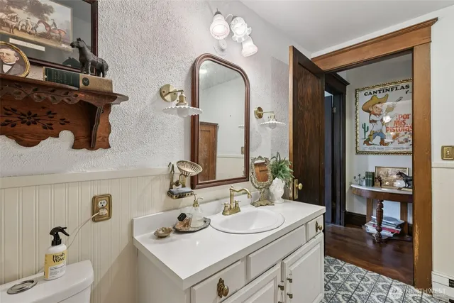 a bathroom with sinks and a mirror