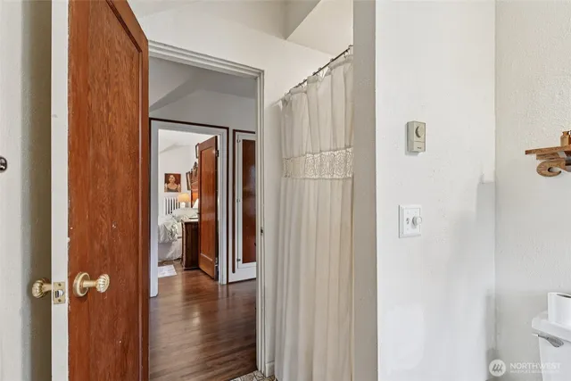 a view of a bathroom from a hallway