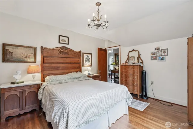 a bedroom with a bed and cabinets