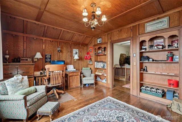 a living room with lots of furniture and a chandelier