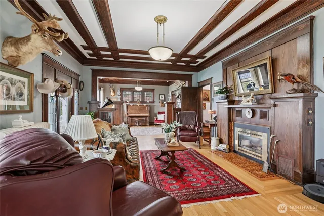 a living room with lots of furniture and a chandelier