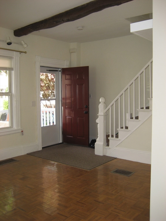 41 Alpine Street Somerville, MA 02144 - Photo 11 of 25 a view of an empty room with a window