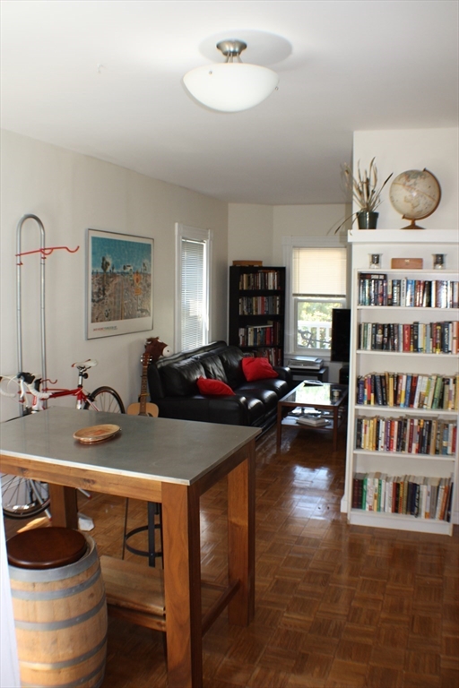 41 Alpine Street Somerville, MA 02144 - Photo 12 of 25 a room with furniture and gym equipment