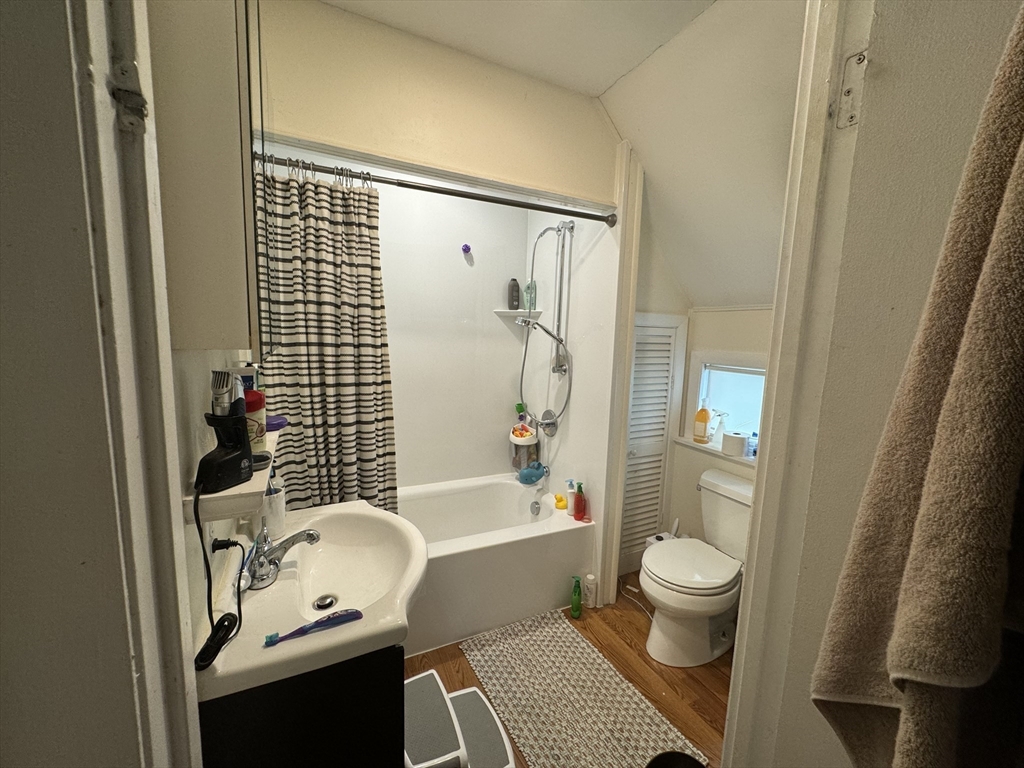 41 Alpine Street Somerville, MA 02144 - Photo 14 of 25 a bathroom with a sink toilet and shower