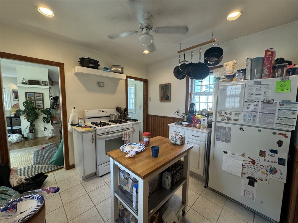 41 Alpine Street Somerville, MA 02144 - Photo 19 of 25 a kitchen with a stove and a refrigerator