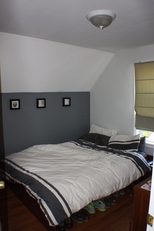 41 Alpine Street Somerville, MA 02144 - Photo 7 of 25 a bedroom with a bed and a window