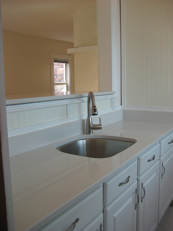 41 Alpine Street Somerville, MA 02144 - Photo 9 of 25 a view white cabinets and a sink