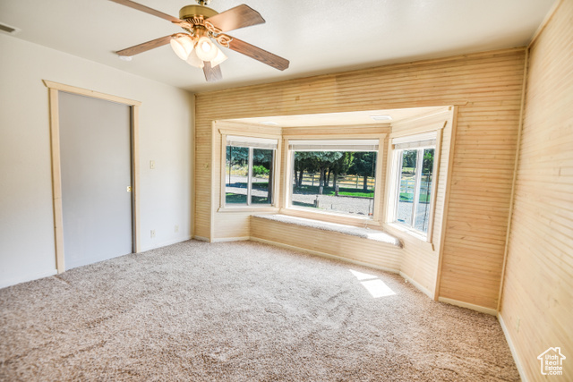 2373 East 190 North Beaver, UT 84713 - Photo 34 of 54 Unfurnished bedroom with multiple windows, carpet flooring, and a ceiling fan