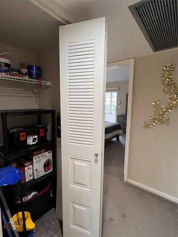 a utility room with cabinets dryer and washer