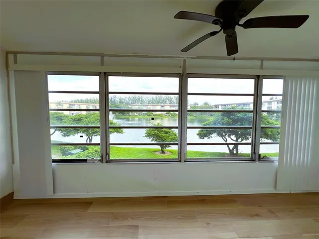 a living room with furniture and a dining table with projector