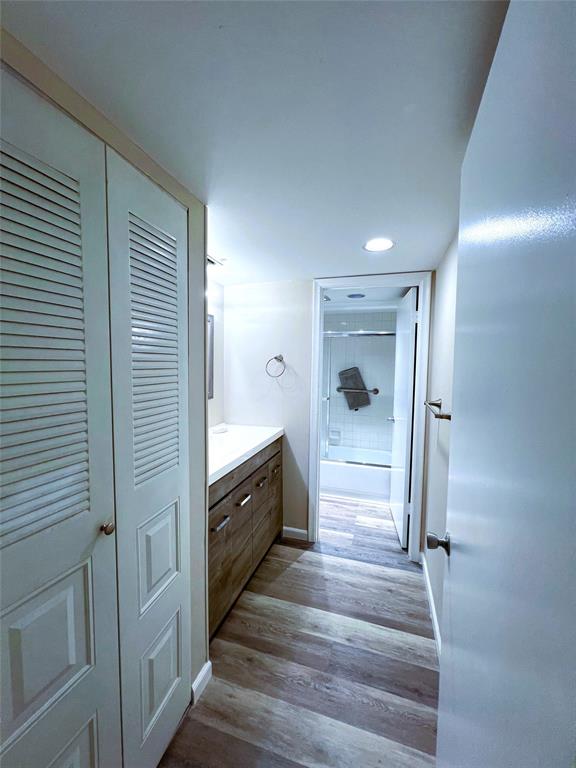 1902 Bermuda Circle, Unit H2 Coconut Creek, FL 33066 - Photo 10 of 32 a view of a hallway to closet and wooden floor